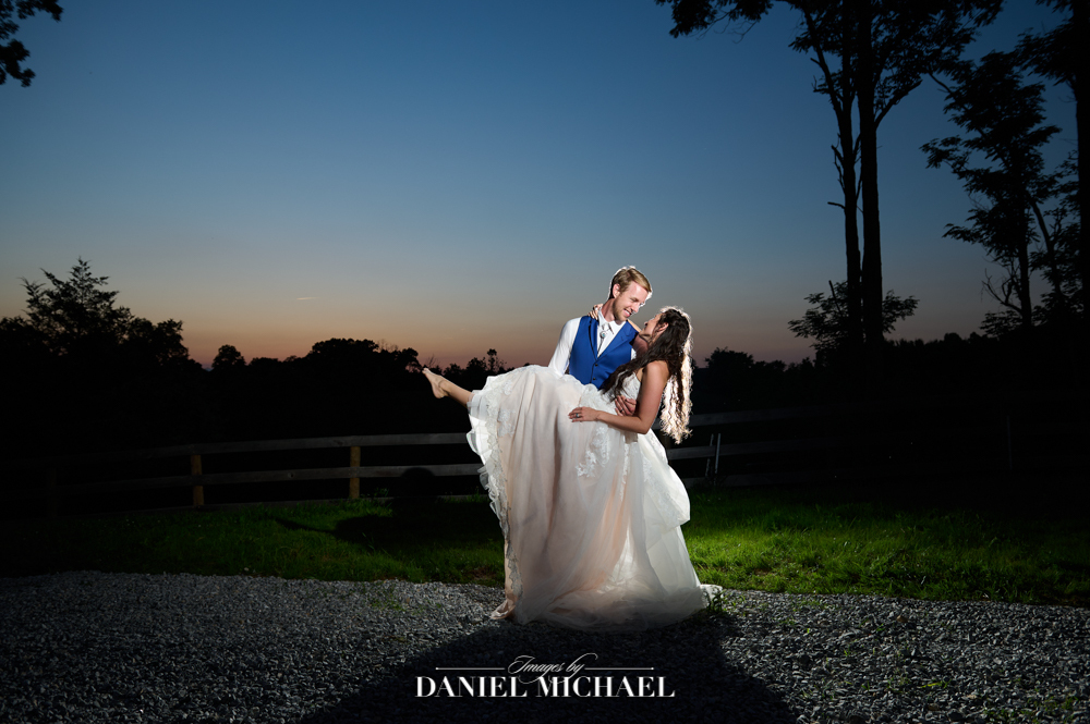 Couple hugging in field